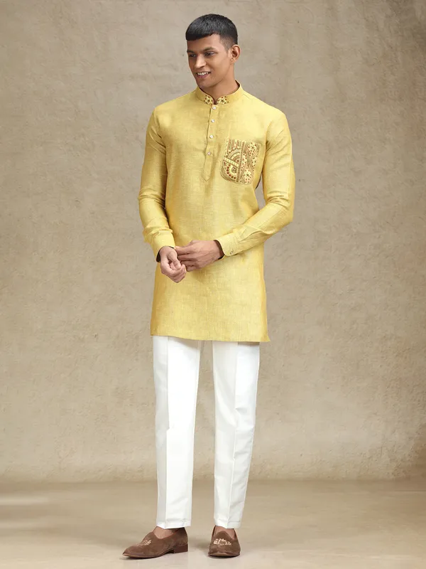 Yellow kurta pajama set in textured embroidery