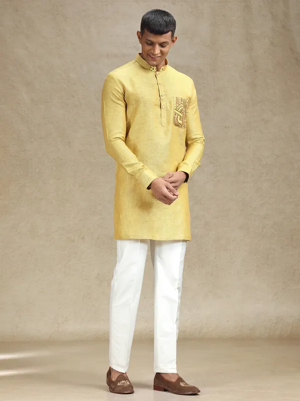 Yellow kurta pajama set in textured embroidery