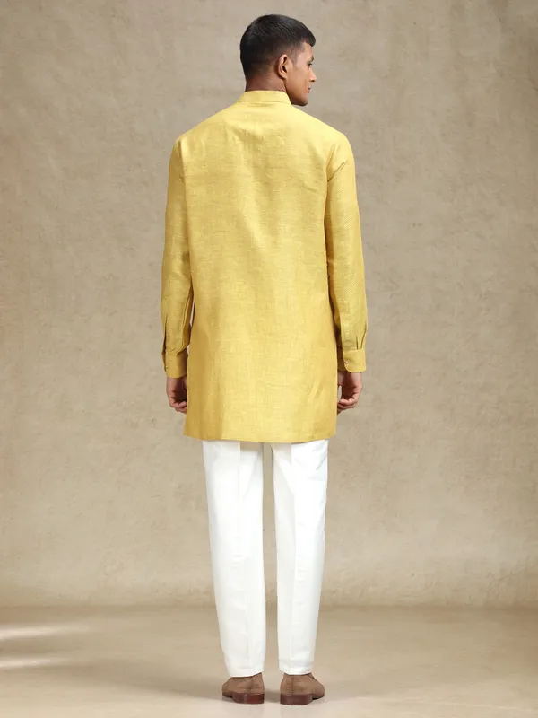 Yellow kurta pajama set in textured embroidery