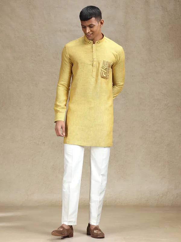 Yellow kurta pajama set in textured embroidery