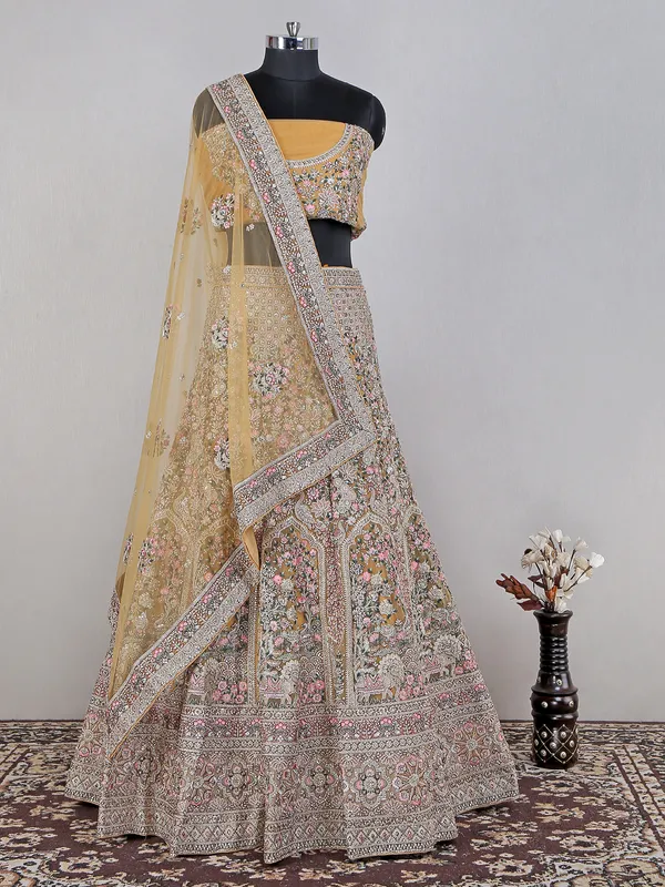 Yellow net lehenga choli for haldi wear