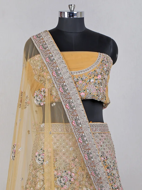 Yellow net lehenga choli for haldi wear
