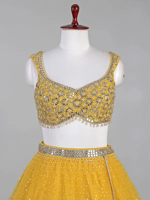 Yellow net lehenga choli with aabla and diamond work