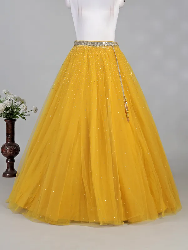 Yellow net lehenga choli with aabla and diamond work