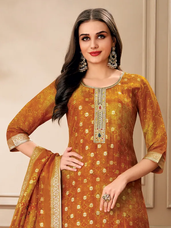 Yellow organza salwar suit with zari work