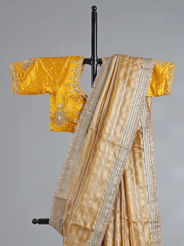 Yellow organza saree with mirror work