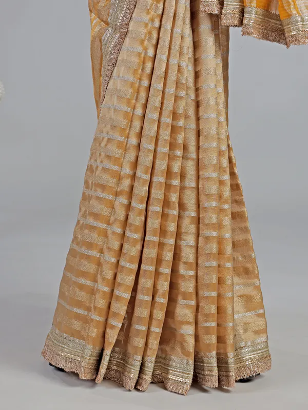 Yellow organza saree with mirror work
