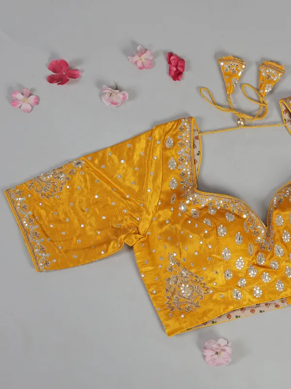 Yellow organza saree with mirror work