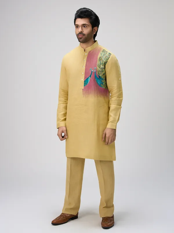 Yellow peacock motif linen kurta ensemble
