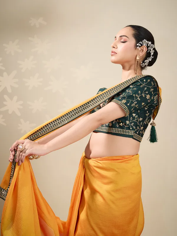 Yellow plain silk saree with green blouse