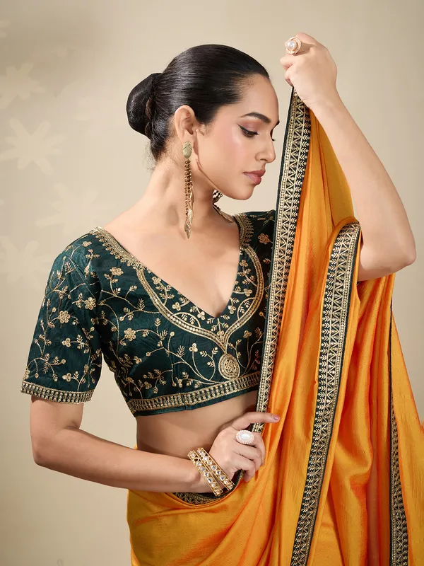 Yellow plain silk saree with green blouse