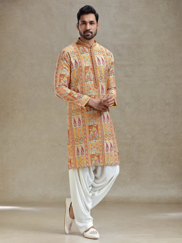 Yellow printed kurta salwar set in embroidery