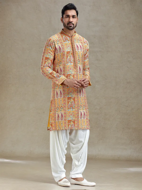 Yellow printed kurta salwar set in embroidery