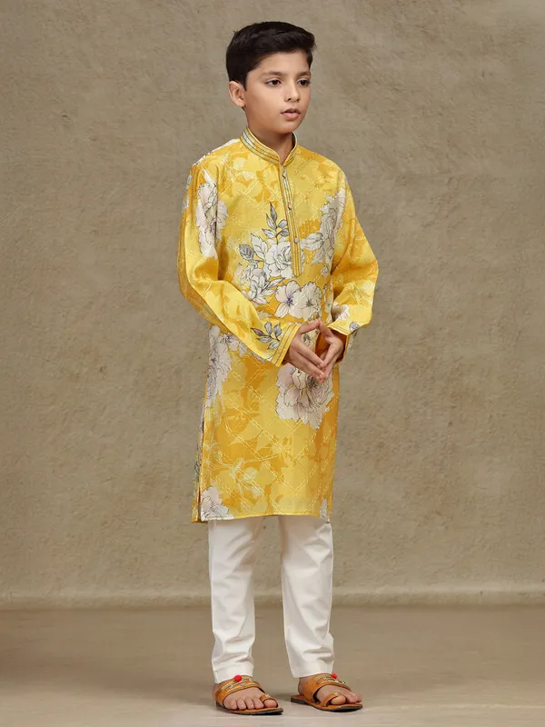 Yellow printed silk kurta suit for festive wear