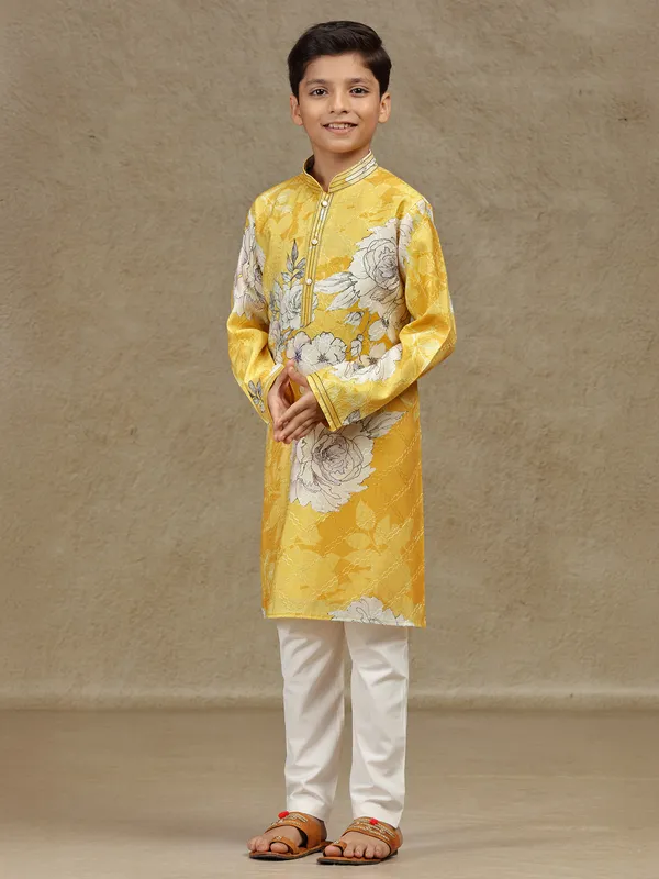 Yellow printed silk kurta suit for festive wear