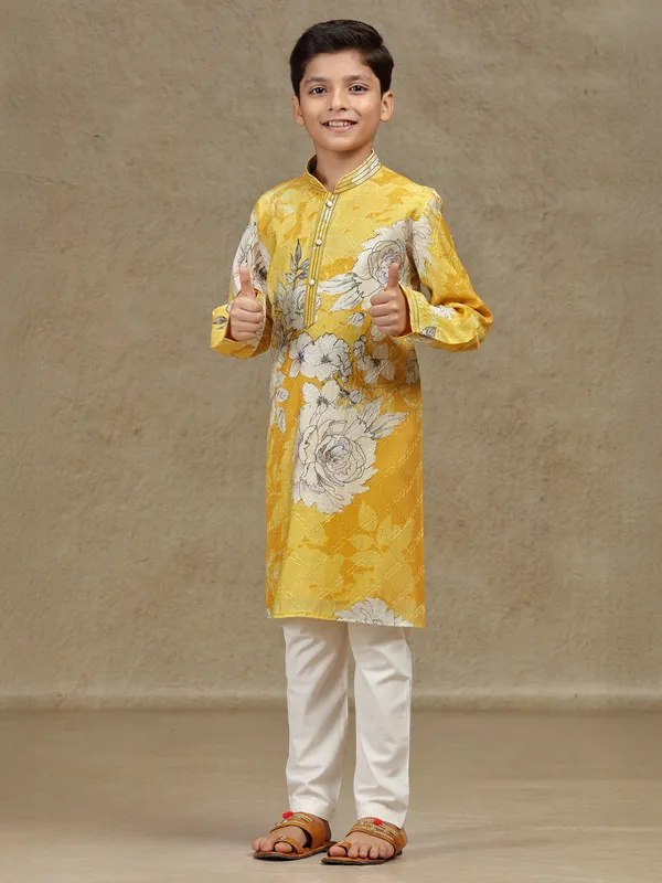 Yellow printed silk kurta suit for festive wear