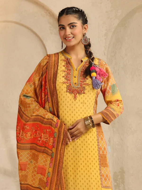 Yellow printed silk salwar suit with beads work