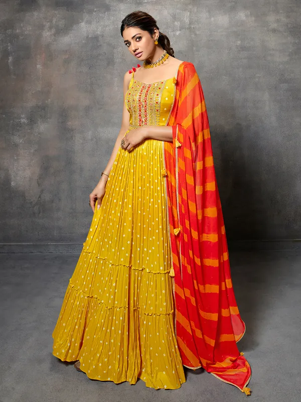 Yellow silk anarkali suit with leheriya dupatta