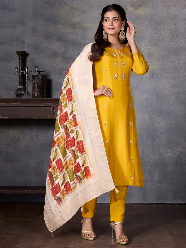 Yellow silk festive wear salwar suit with print