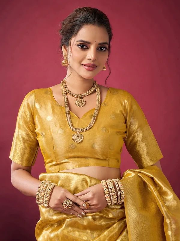 Yellow silk festive wear saree with zari work
