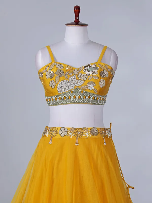 Yellow silk haldi wear lehenga choli with shrug