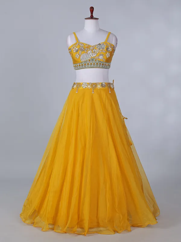 Yellow silk haldi wear lehenga choli with shrug
