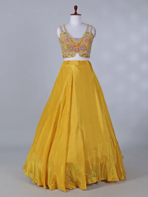 Yellow silk jacket style lehenga choli for haldi
