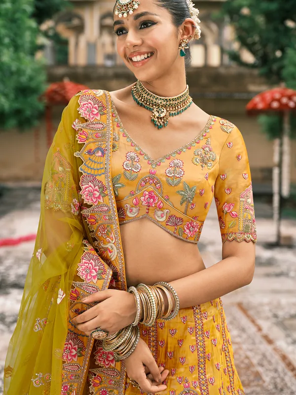 Yellow silk lehenga choli for haldi celebration