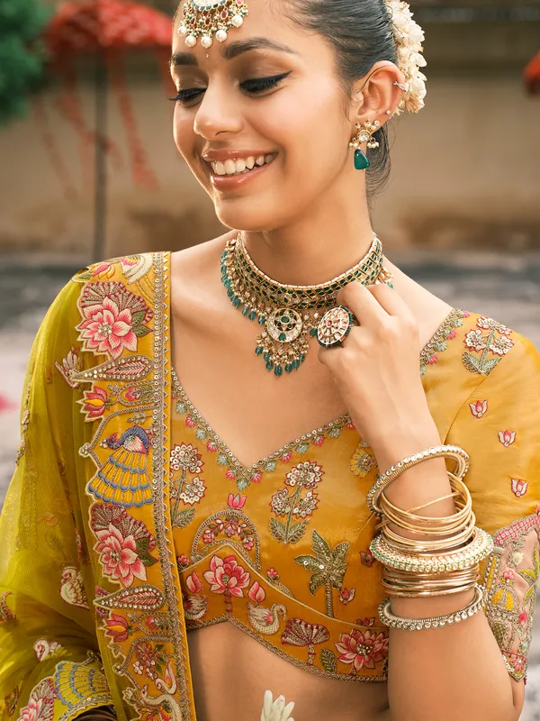 Yellow silk lehenga choli for haldi celebration