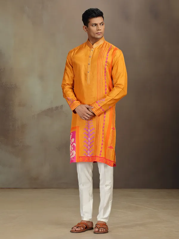 Yellow silk printed kurta suit with resham and sequins work
