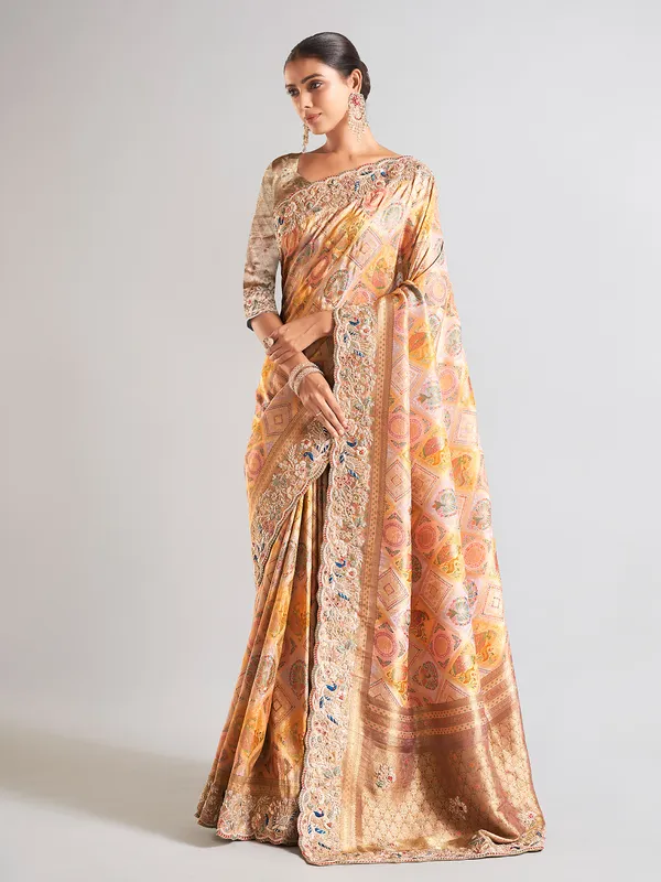 Yellow silk printed saree with embellished border