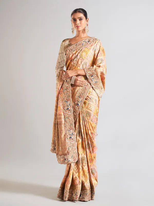 Yellow silk printed saree with embellished border