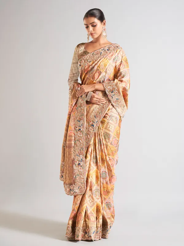 Yellow silk printed saree with embellished border