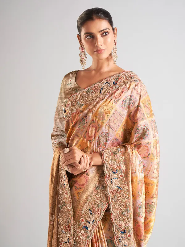 Yellow silk printed saree with embellished border