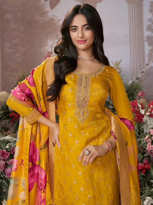 Yellow silk salwar suit with printed dupatta for festive wear