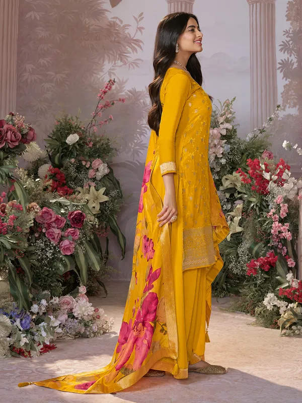 Yellow silk salwar suit with printed dupatta for festive wear