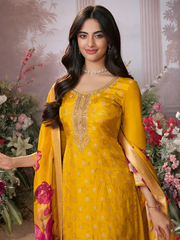 Yellow silk salwar suit with printed dupatta for festive wear