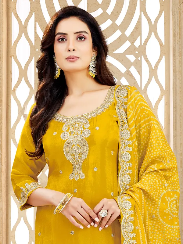 Yellow silk salwar suit with resham and zardosi glow