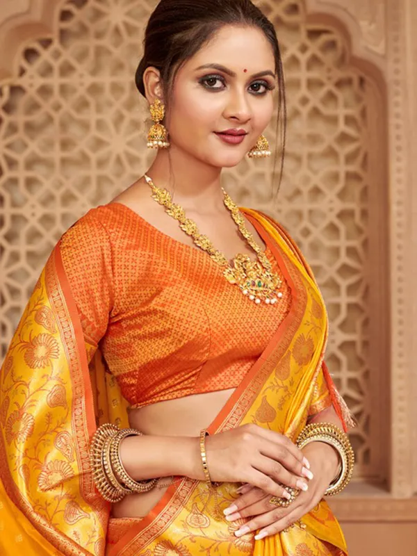 Yellow silk saree with colorful motifs