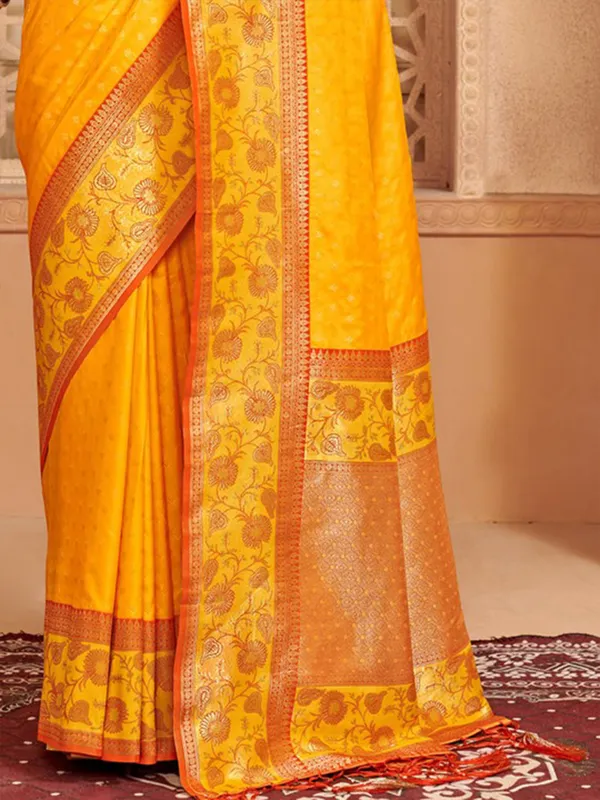 Yellow silk saree with colorful motifs