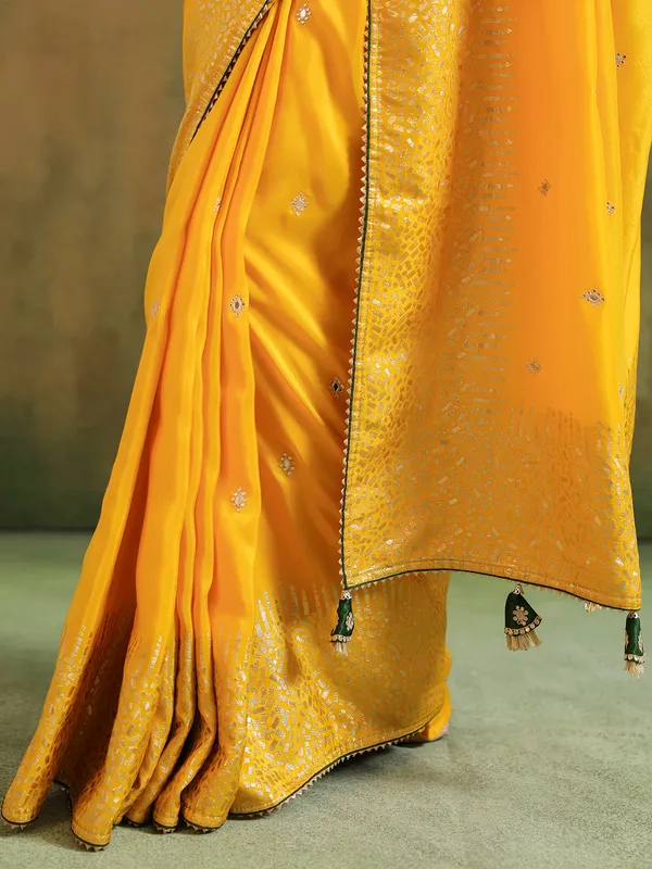 Yellow silk saree with green blouse