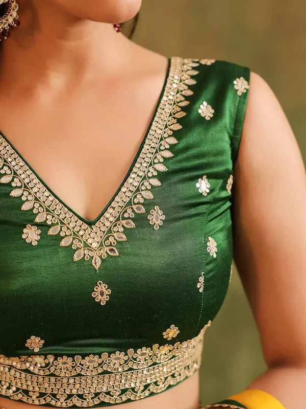 Yellow silk saree with green blouse