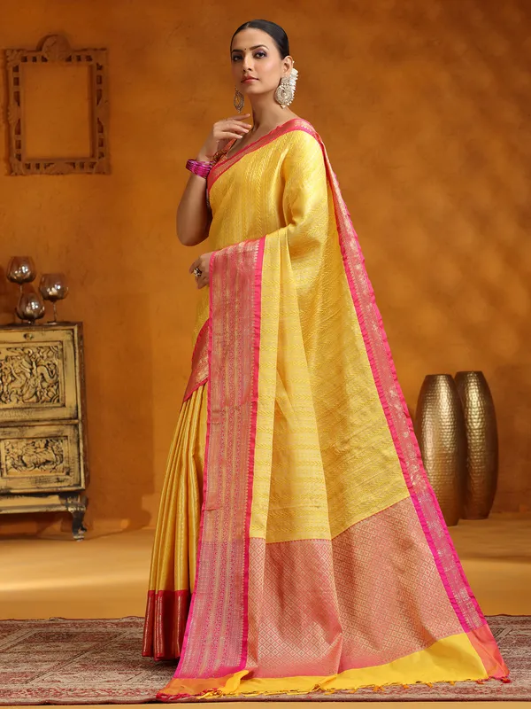 Yellow silk saree with zari embellishment