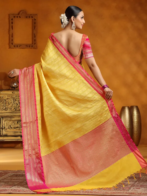 Yellow silk saree with zari embellishment