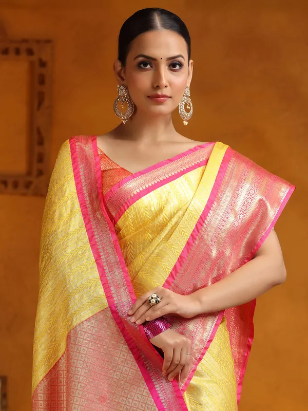 Yellow silk saree with zari embellishment