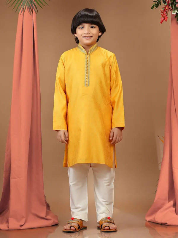 Yellow silk textured kurta suit