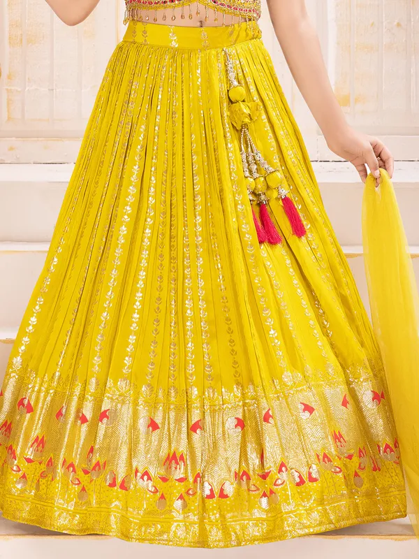 Yellow silk wedding wear lehenga choli with shimmering zari