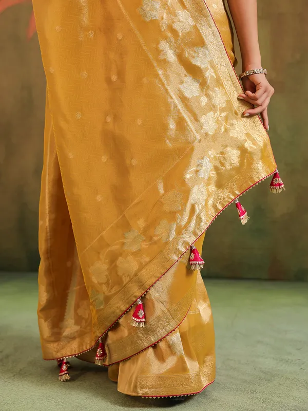 Yellow silk zari embellished saree with magenta blouse