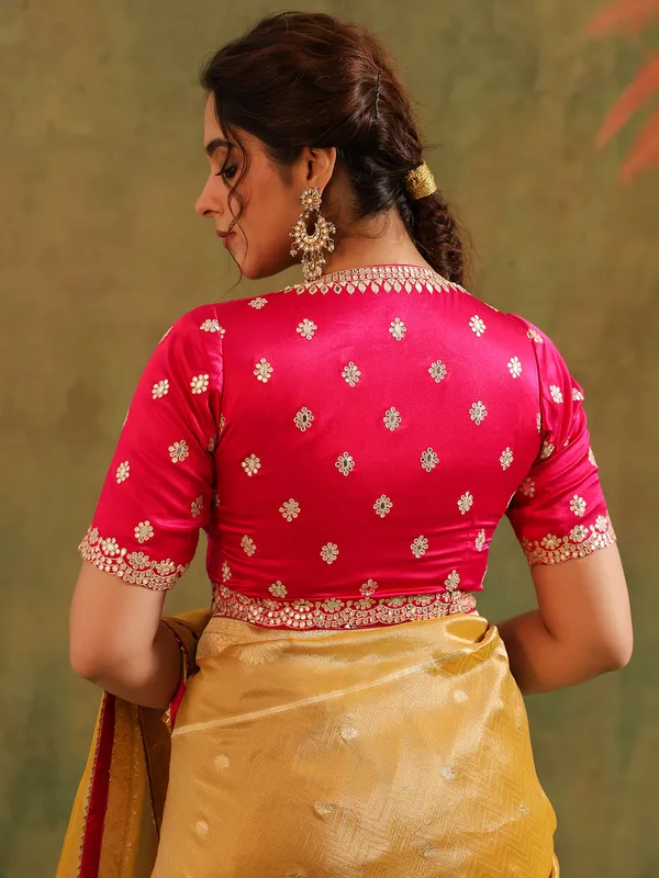 Yellow silk zari embellished saree with magenta blouse