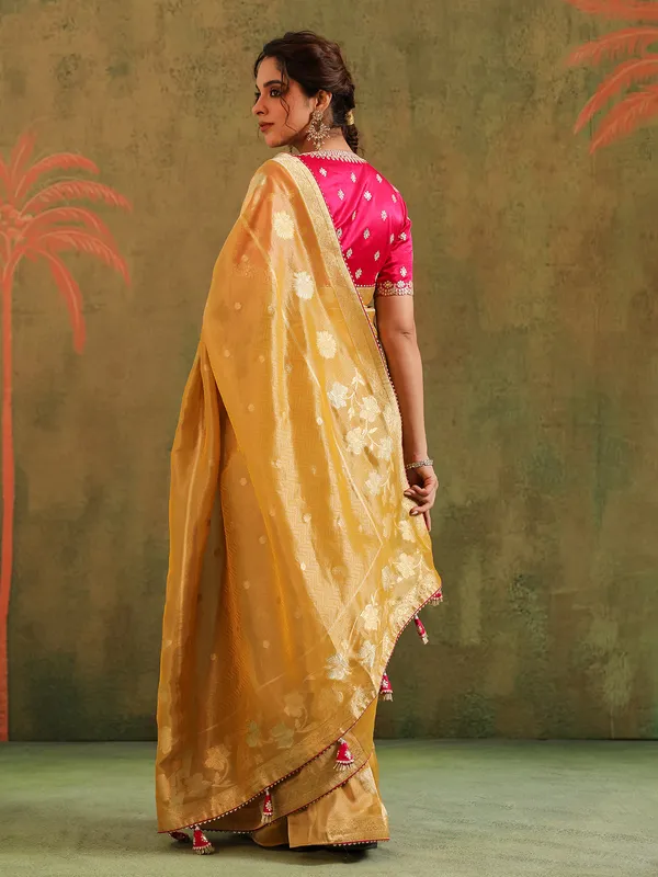 Yellow silk zari embellished saree with magenta blouse